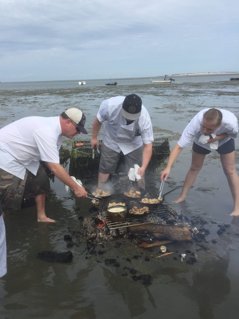 Cooking on fire on wet sand