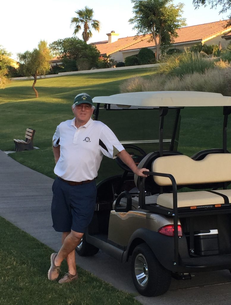 Happy guy with his golf cart